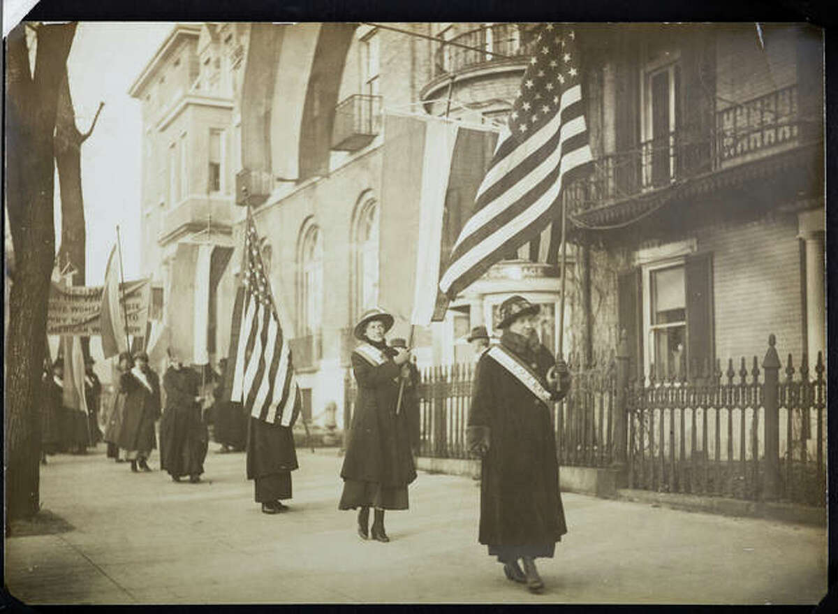 Women suffragists march in a photograph that is part of “Voices and Votes: Democracy in America,” a traveling exhibit that is part of the Smithsonian Institution’s “Museum on Main Streets” program. The exhibit is tentatively set to appear in the atrium of the Madison County Administration Building July 17 – Aug. 21.