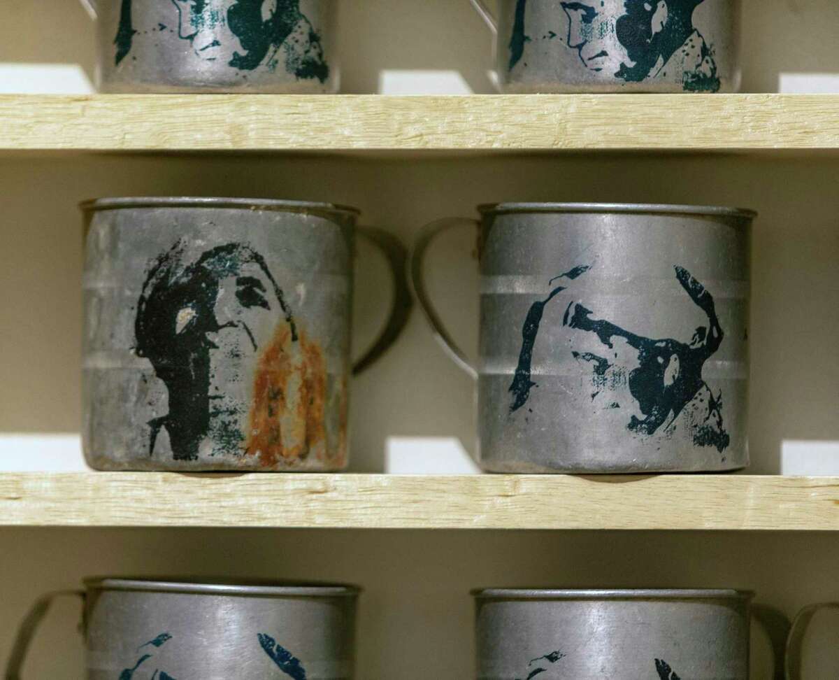 Screenprints depicting artist Djiradj Ramsamoedj’s grandmother are on the front of mugs similar to those used in her home in Ramsamoedj’s installtion, “Adjie Gilas.” The name translates as “Grandmother’s Cup.”