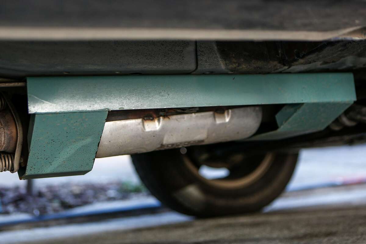 The steel plate protecting Janice Suess' catalytic converter is seen on her Honda Element on Sunday, February 21, 2021 in San Francisco, Calif. Guess had the stolen off her Honda Element not once but twice in the last six months, costing her thousands to replace.