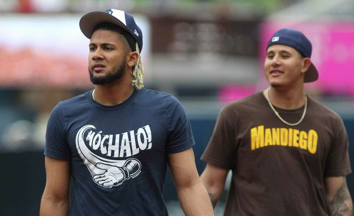In Fernando Tatis Jr., left, and Manny Machado, the San Diego Padres have two infielders whose contracts will pay them a respective $340 million and $300 million.