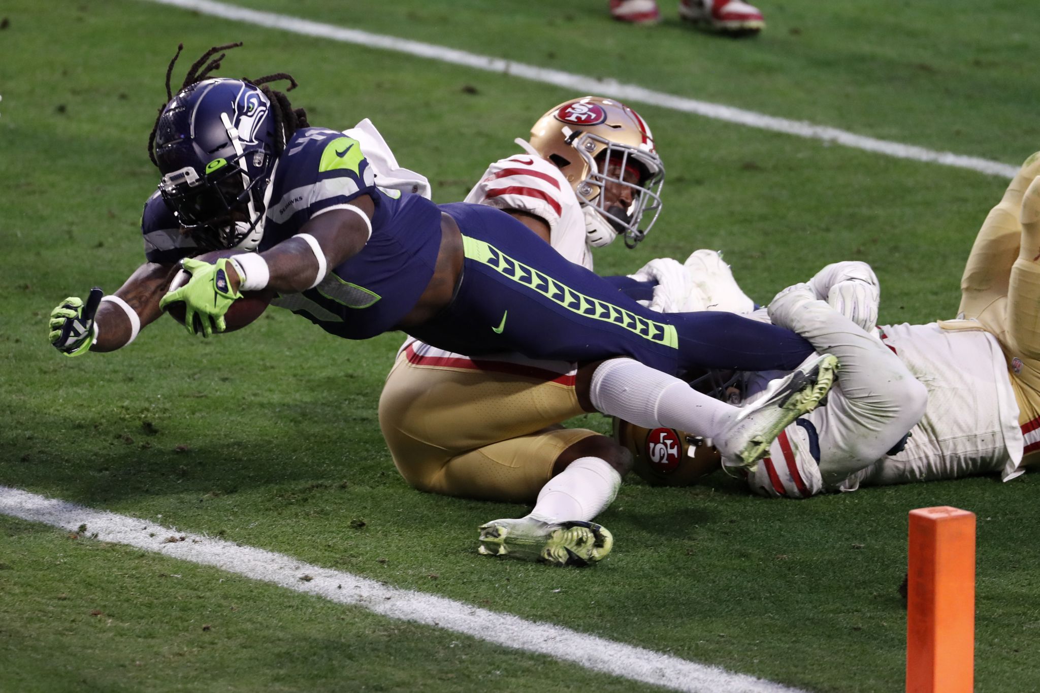 Seattle Seahawks running back Alex Collins carries the ball against the  Denver Broncos during the first half of an NFL football preseason game,  Saturday, Aug. 21, 2021, in Seattle. (AP Photo/John Froschauer