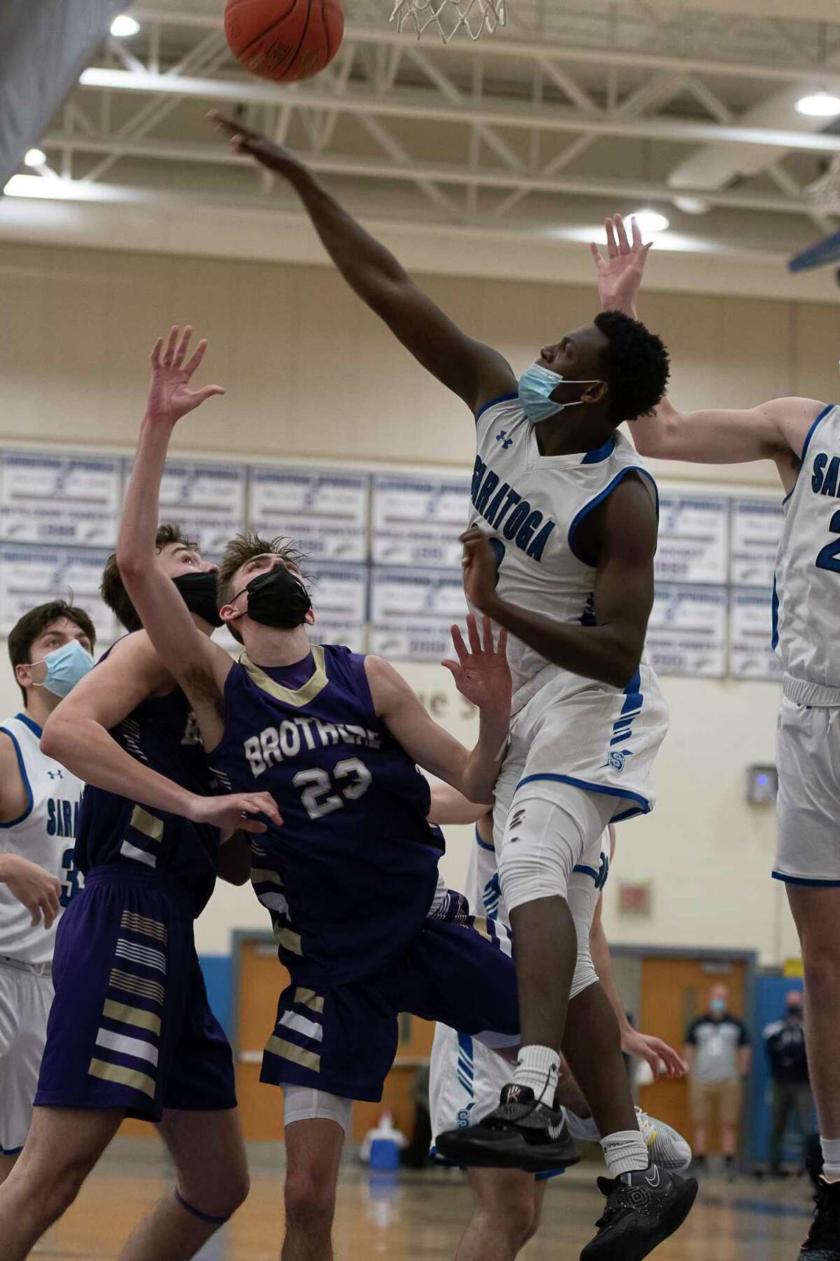Saratoga's Kaleb Lewis blocks a shot from CBA's Hagen Foley during a game on Wednesday, Feb. 24, 2021, in Saratoga Springs, N.Y. (Jenn March, Special to the Times Union)