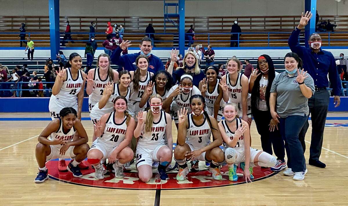 The Hardin-Jefferson girls basketball poses for a picture after defeating Silsbee Wednesday night during a regional-quarterfinal game in Beaumont.