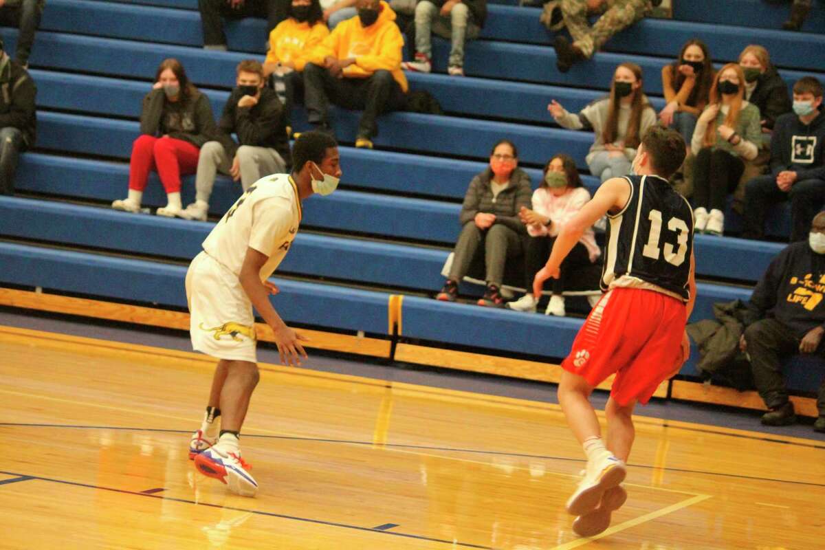 Baldwin's Carmelo Lindsey (left) focuses on defensive pressure in recent boys basketball action. (Star photo file)