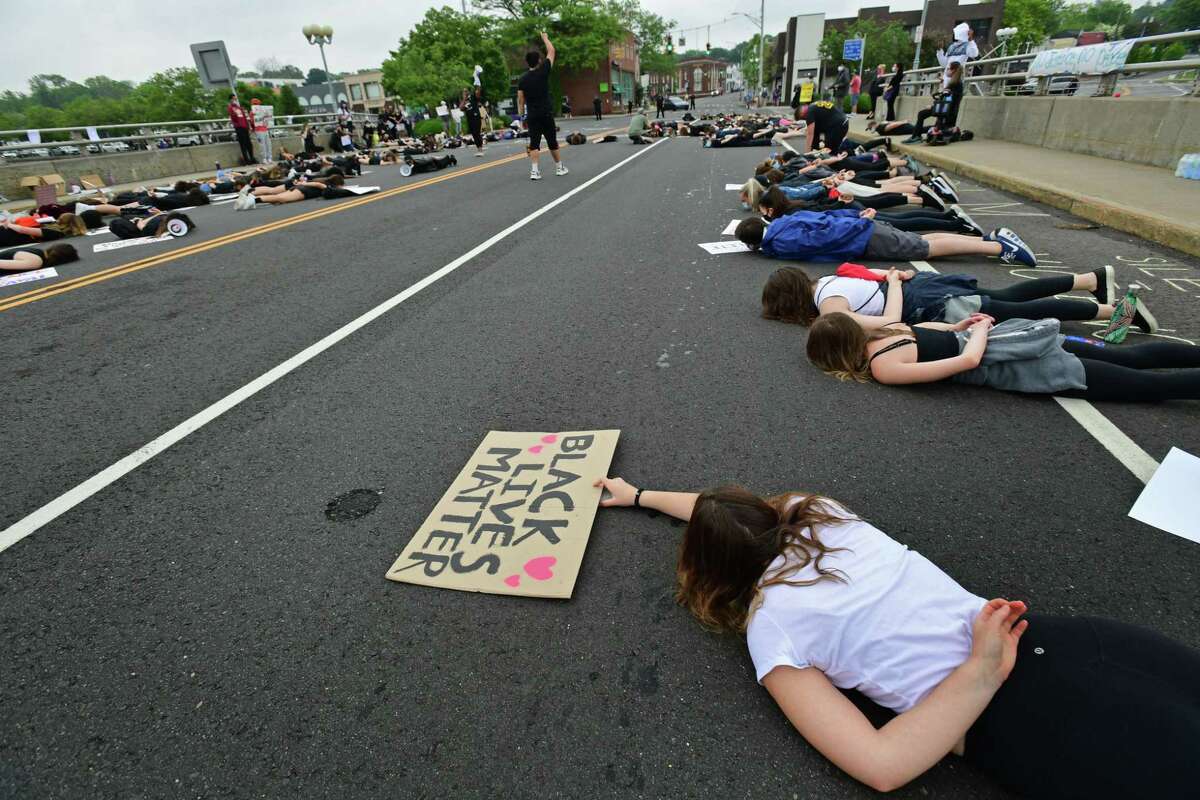 Several former and current Staples High School students organize a group of close to 1,000 protestors June 5 in downtown Westport. The group marched from the Post Road bridge to the police station in a peaceful protest against police brutality. Westport officials will issue surveys this spring as part of their effort to examine the district’s equity, as well as get an idea of the issues facing students.