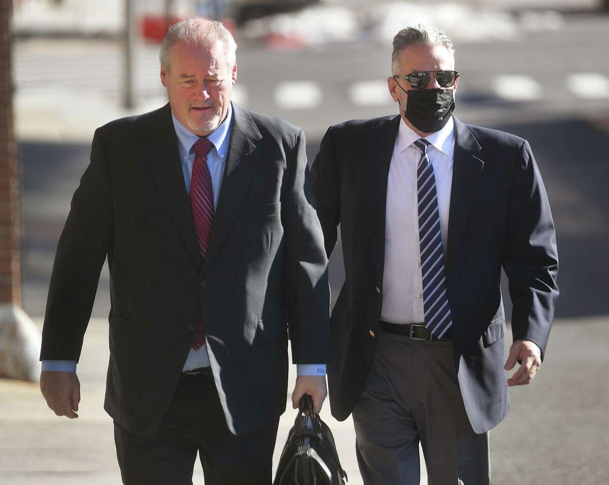 Accompanied by his lawyer Edward Gavin, left, John Vazzano, of Trumbull, arrives for his arraignment on bribery charges in Superior Court in Bridgeport, Conn. on Thursday, February 25, 2021.