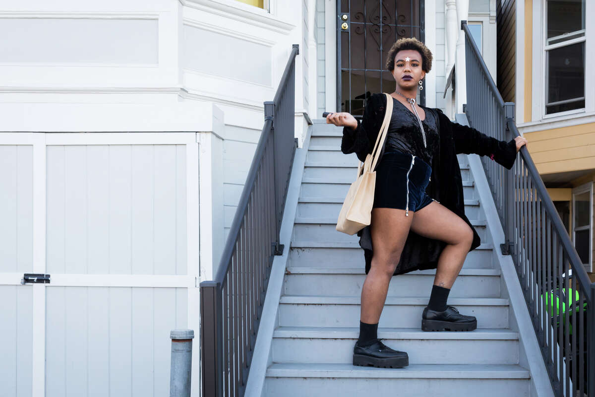Yasmine Rosa, a member of We Are The Ones, models her Telfar bag and stun gun in Oakland, Calif.