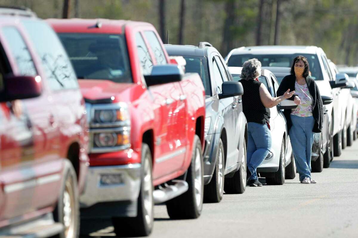 Continued gridlock at Interstate 45 and Texas 242 Wednesday, forcing CHI St. Luke’s Health The Woodlands to cut its efforts to administer second dose COVID-19 vaccination for the second time this week. In this file photo, residents wait to take part in a drive-thru COVID-19 vaccination at the East Montgomery County Senior Center Feb. 3 in New Caney.