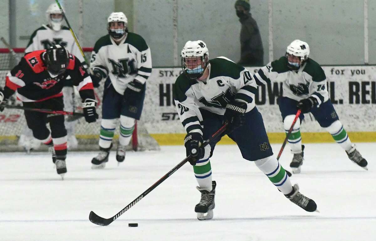 Captain Finn Cullen and the Norwalk high school co-op team take on the Milford co-op team in CIAC action Wednesday at SoNo Ice House in Norwalk.
