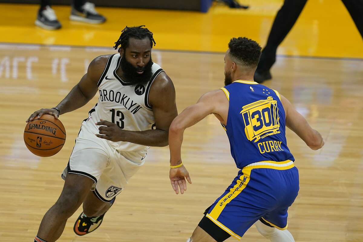Warriors guard Stephen Curry defends Brooklyn guard James Harden during a Feb. 13 game at Chase Center.