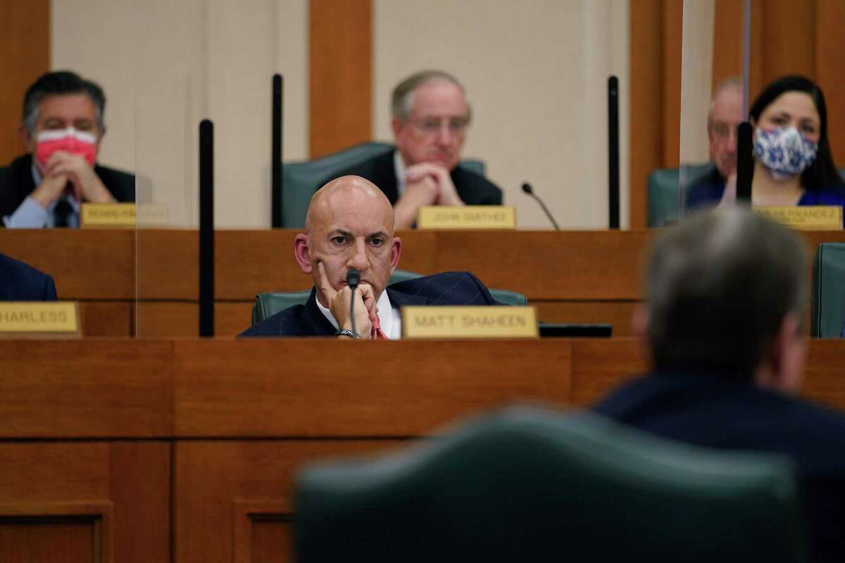 Rep. Matt Shaheen, R-Plano, and other members listens to witness Kirk Morgan answers questions as the Committees on State Affairs and Energy Resources holds a joint public hearing to consider the factors that led to statewide electrical blackouts, Thursday, Feb. 25, 2021, in Austin, Texas. The hearings were the first in Texas since a blackout that was one of the worst in U.S. history, leaving more than 4 million customers without power and heat in subfreezing temperatures. (AP Photo/Eric Gay)