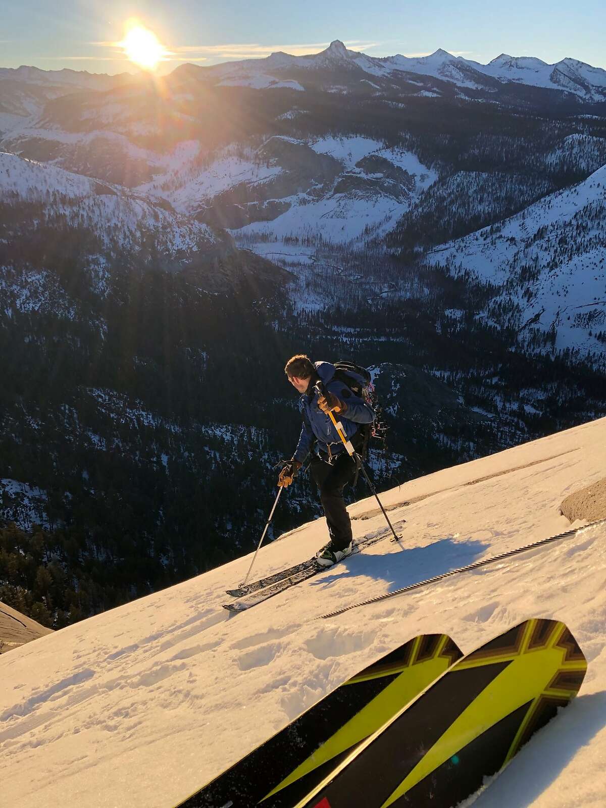 Zach Milligan (pictured) and Jason Torlano look down into Yosemite Valley during a ski descent of Half Dome