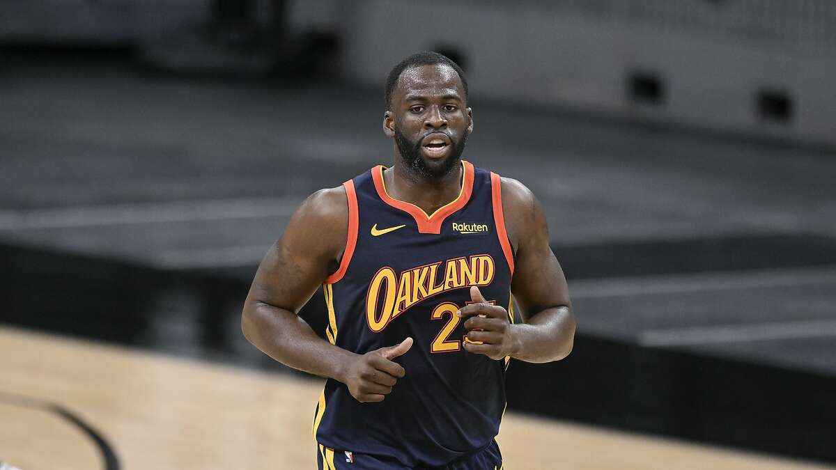 Golden State Warriors' Draymond Green runs up the court during the second half of an NBA basketball game against the San Antonio Spurs, Monday, Feb. 8, 2021, in San Antonio.