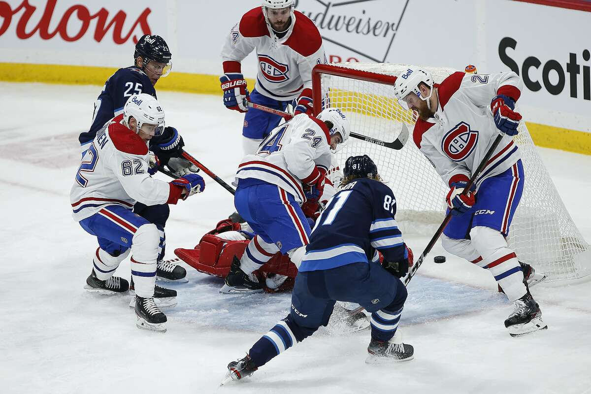 Winnipeg’s Kyle Connor (81) scores one of his two goals against Montreal, which lost the debut game of its interim head coach.