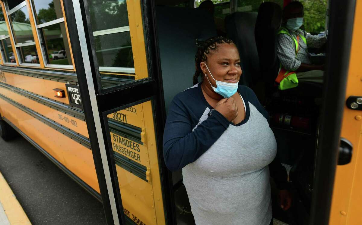 Bus monitors including Tanesha Joyner help students board buses at Fox Run Elementary School Thursday, September 16, 2020.