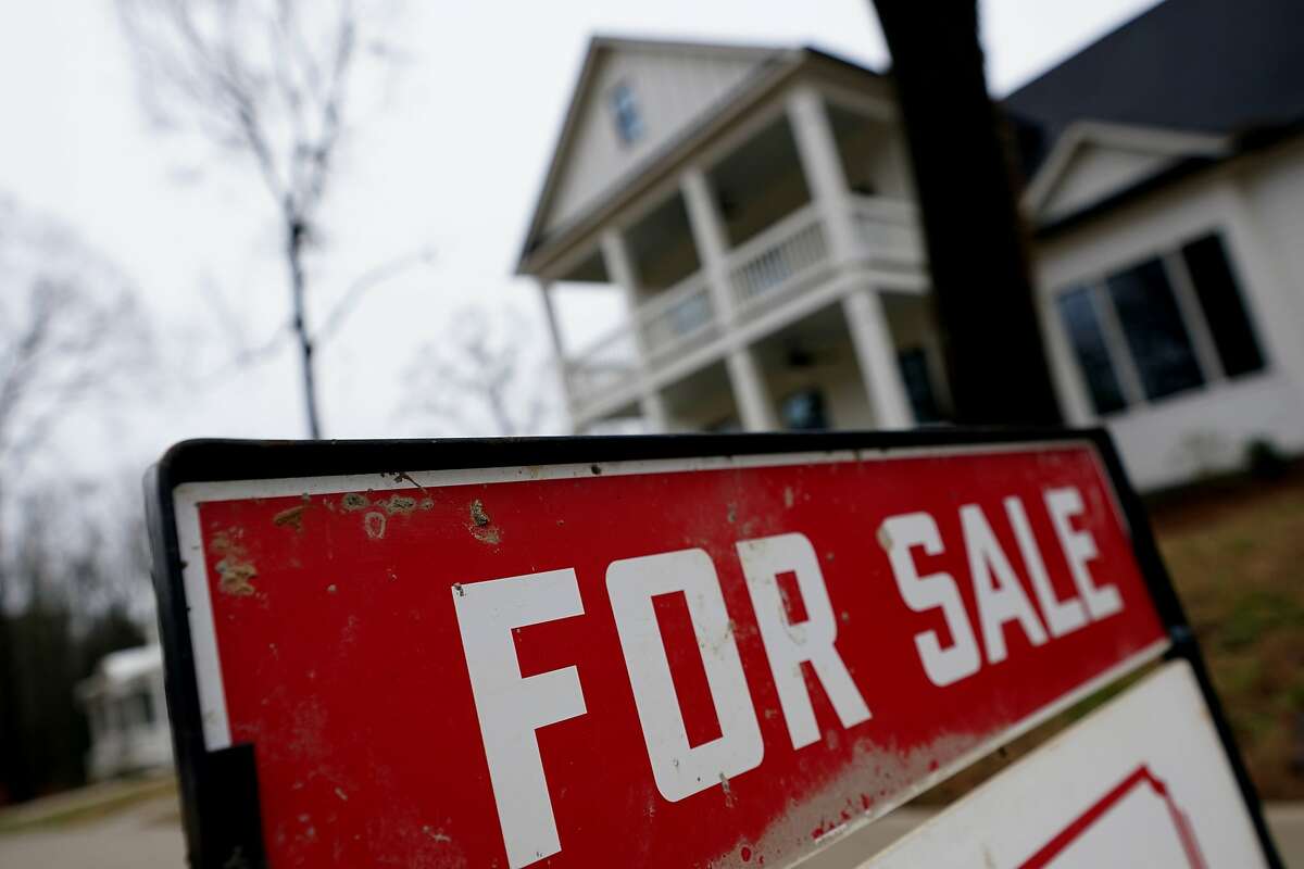 A new home is for sale in Madison, Ga., Thursday, Feb. 18, 2021. U.S. long-term mortgage rates rose this week but still remain near historic lows as the pandemic-hobbled economy strains toward recovery with more Americans getting vaccinated against the coronavirus. (AP Photo/John Bazemore)