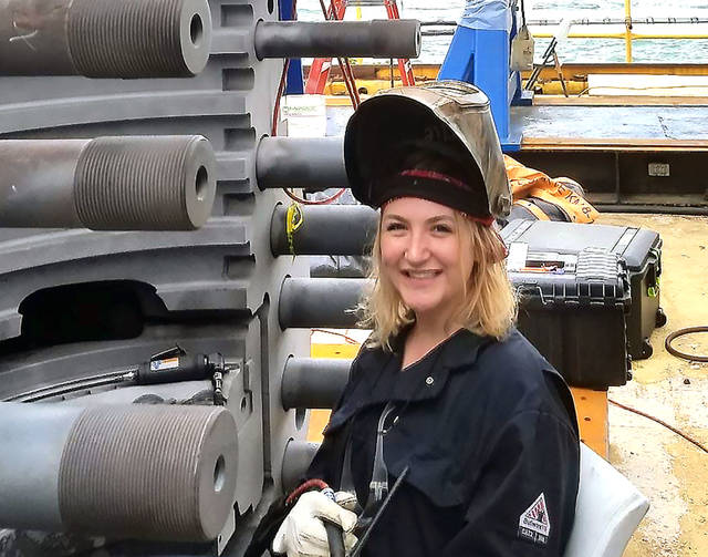 Woman welder teaching others at L&C - Vimarsana News