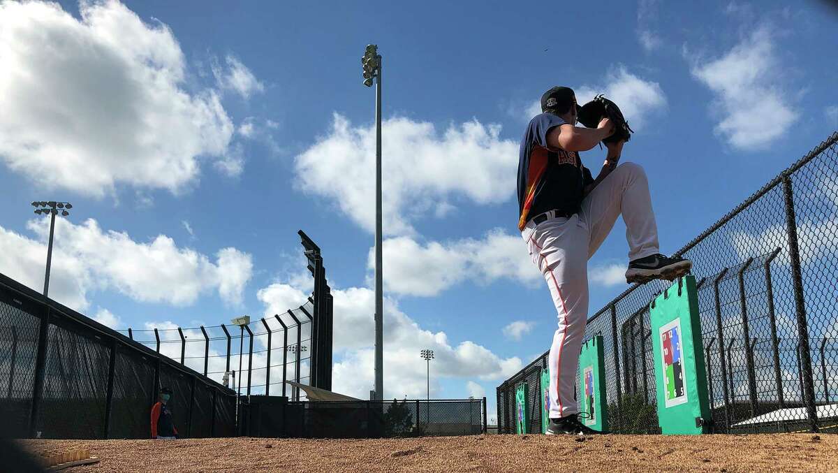 Houston Astros pitcher Hunter Brown (94) throws in the bullpen during spring training workouts for the Astros at Ballpark of the Palm Beaches in West Palm Beach, Florida, Friday, February 26, 2021.