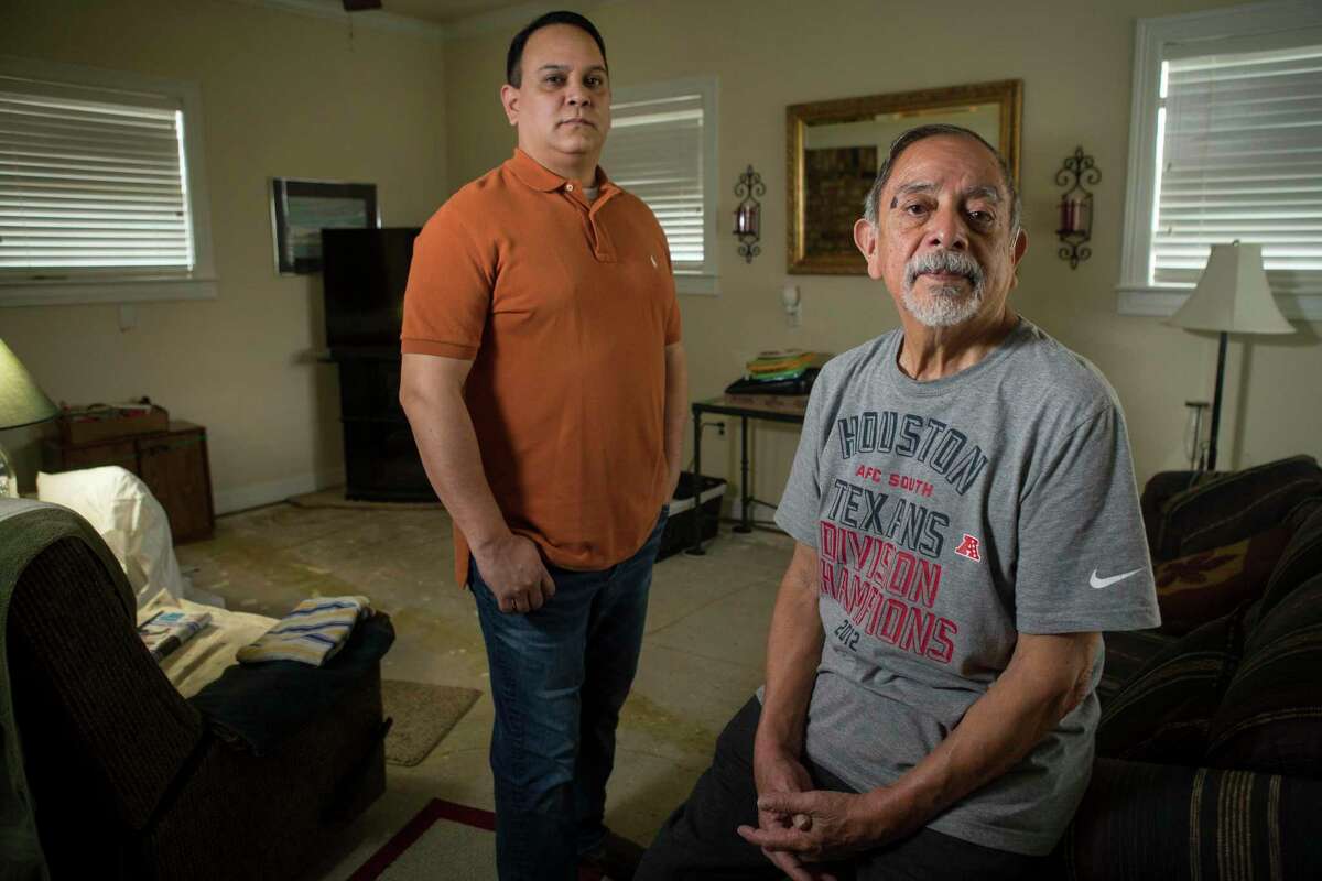 Isaac and Lawrence Ibarra, who are mourning the loss of Isaac's brother, Gilbert Rivera, pose for a portrait Wednesday, Feb. 24, 2021 in Houston. Rivera died of hypothermia after his apartment lost power amid bitter cold temperatures during the week of Feb. 14, 2021.