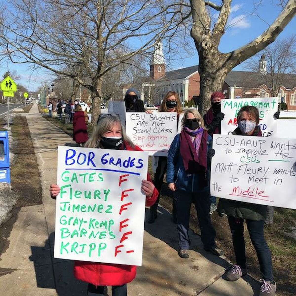 Protesters gather outside at Southern Connecticut State University to call attention to a new contract between the Board of Regents and the professors that the professors say will harm students, cut funding and remove academic freedoms.
