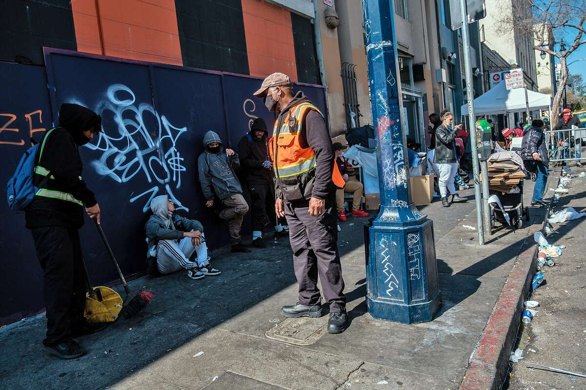 Private security guard Ron Haysbert keeps an eye on the sidewalk on the corner of Hyde and Golden Gate, a known corner for drug traffic, where La Cocina is preparing to open a new space for immigrant women to sell their food.