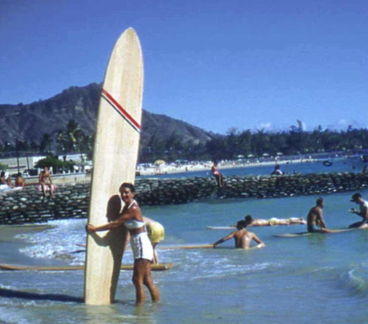 Betty Winstedt at Kuhio Beach with her Joe Quigg board, 1955. She began her career as a surfer at 41.