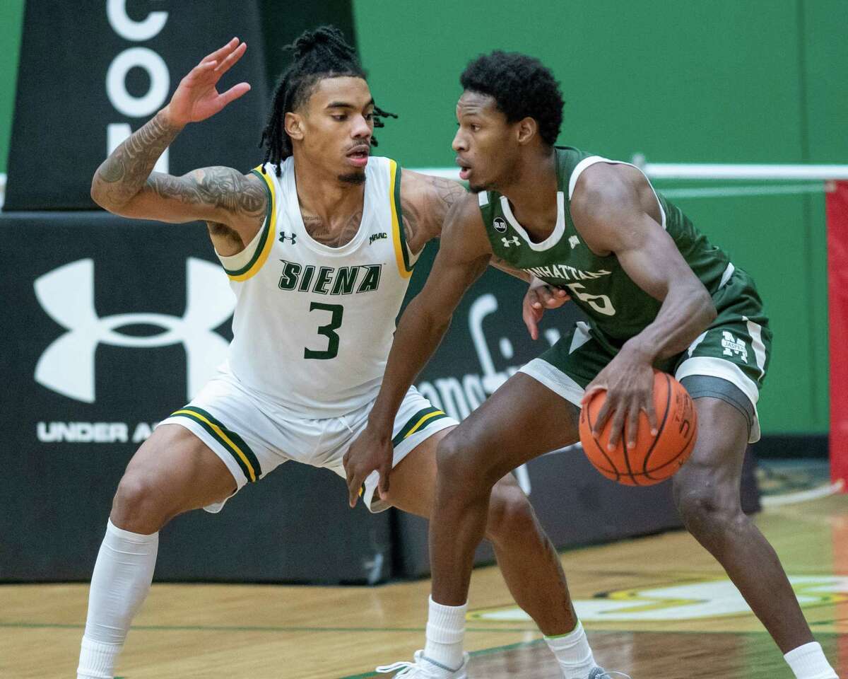 Siena College senior Manny Camper plays defense against Manhattan College junior Samba Diallo during a Metro Atlantic Athletic Conference game at the UHY Center on the Siena campus in Loudonville, NY, on Friday, Feb. 26, 2021 (Jim Franco/special to the Times Union.)