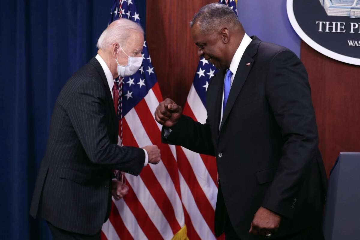 Secretary of Defense Lloyd Austin and President Joe Biden bump fists in greeting at the Pentagon in Arlington, Va., on Wednesday, Feb. 10, 2021. Biden on Wednesday paid tribute to Black Americans serving in the military during his first visit to the Pentagon since taking office, vowing to embrace diversity as a strength at a time of racial reckoning inside the Defense Department. (Oliver Contreras/The New York Times)