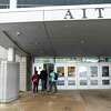 Students enter the Academy of Information Technology & Engineering (AITE) in Stamford, Conn. Tuesday, Feb. 23, 2021.