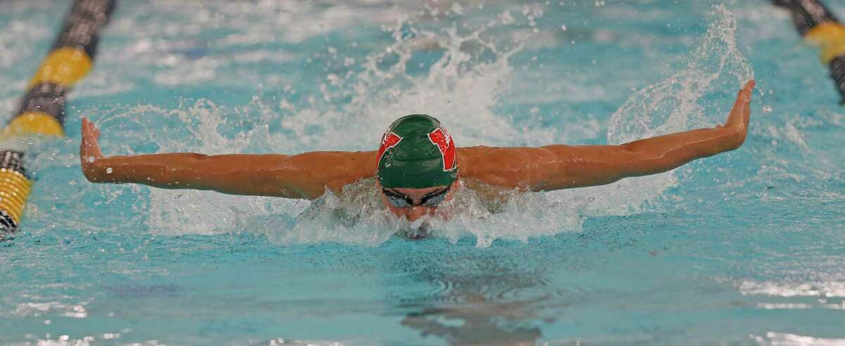 The Woodlands’ Tyler Hulet competes in the 100-yard butterfly at the UIL boys 6A swimming finals on Friday, Feb. 26, 2021, at Josh Davis Natatorium.