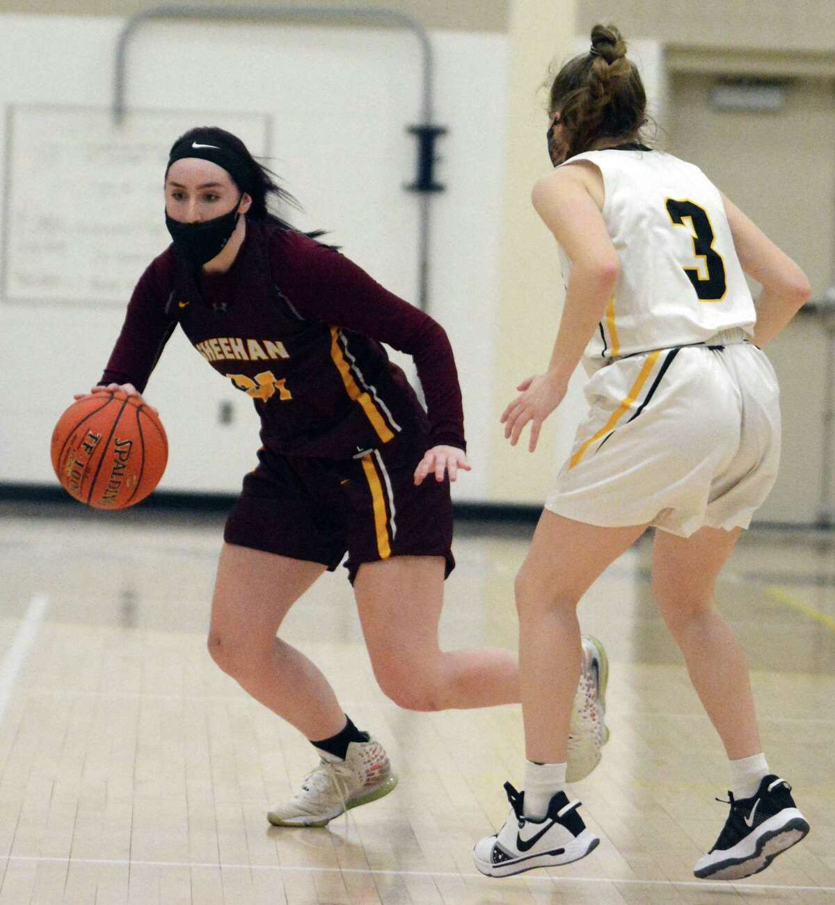 Sheehan’s Hayleigh Lagasse, left, dribbles while defended by Hand’s Hadley Houghton earlier this season.