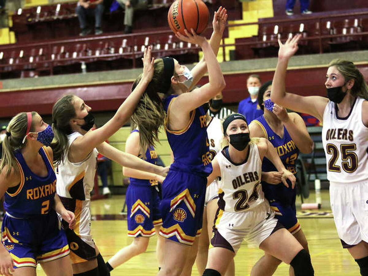 Roxana’s Abbie Gehrs puts up a shot in traffic against EA-WR in a Feb. 6 game in Wood River. On Friday night in Carlinville, the Shells ended a 30-game losing streak in South Central Conference play by beating the Cavaliers.