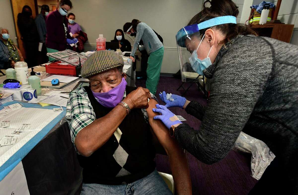 Stamford residents including Jesse Mercer receive their shot during pop-up clinic for COVID-19 vaccination Saturday, February 27, 2021 for first and second doses at the Bethel AME Church in Stamford, Conn. This clinic is set up to support vaccination within communities of color and for those who do not have the ability to make appointments online. The clinic will be held again on March 27 (10am-3pm).