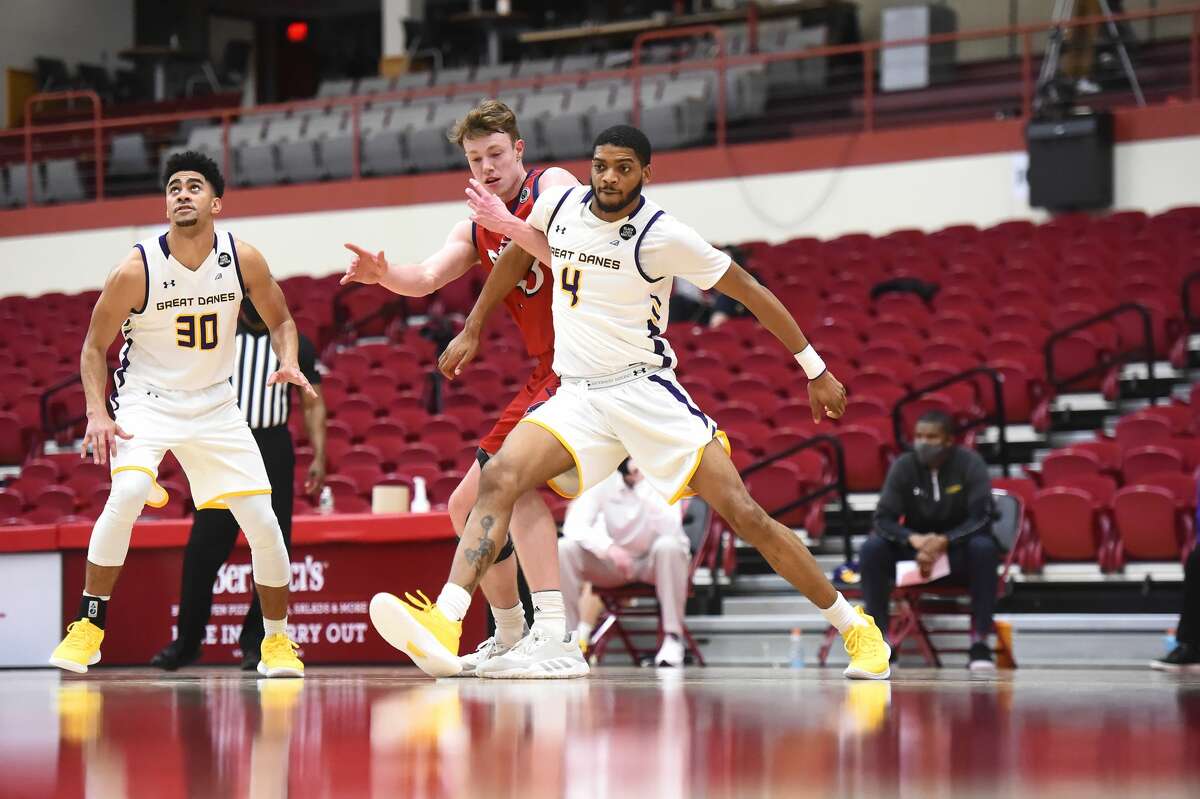 UAlbany forward Jarvis Doles (4) boxes out NJIT's Kjell de Graaf as Chuck Champion looks on in an America East Tournament basketball game Saturday, Feb. 27, 2021, in Hartford, Conn. UAlbany won, 76-66. (Steve McLaughlin/Hartford Athletics)