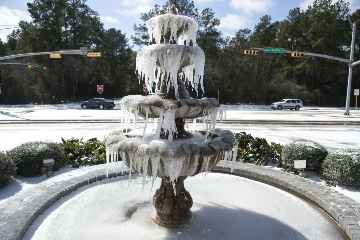 A fountain along Aldine-Westfield at Bellchase Drive is covered with ice in Spring on Feb. 15.