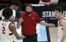Stanford coach Jerod Haase, center, speaks to guard Bryce Wills (2) during the second half of an NCAA college basketball game against Oregon State in Stanford, Calif., Saturday, Feb. 27, 2021. (AP Photo/Josie Lepe)