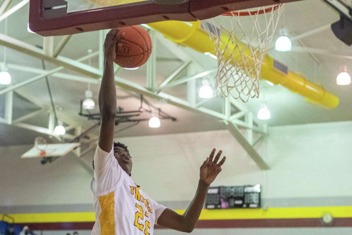 Timberwolves Clarence Payia (22) goes in close for a shot in the fourth qurater. The Beaumont United Timberwolves basketball team faced off with the Hardin-Jefferson Hawks at BU Thursday night Photo made on December 3, 2020. Fran Ruchalski/The Enterprise