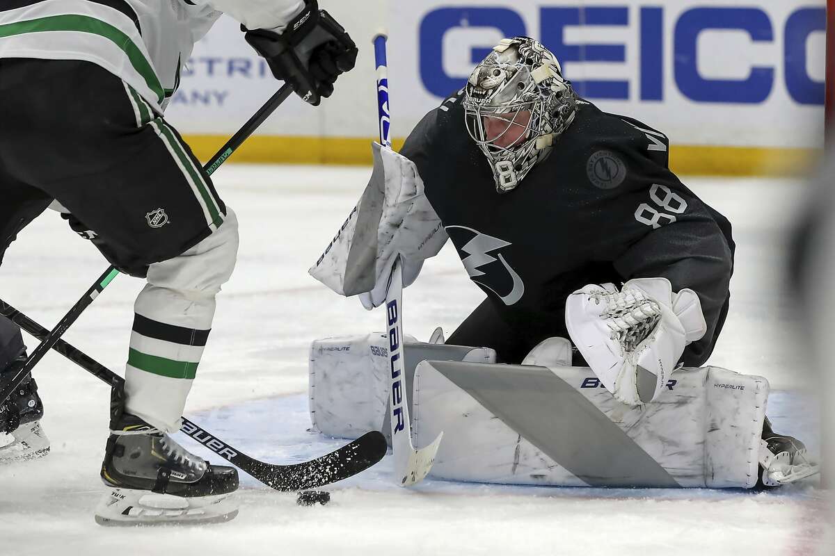 Lightning goalie Andrei Vasilevskiy stops a third-period shot against the Stars, one of 20 saves in his 23rd career shutout.