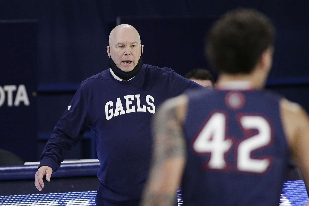 Saint Mary's head coach Randy Bennett directs his players during the second half of an NCAA college basketball game against Gonzaga in Spokane, Wash., Thursday, Feb. 18, 2021. (AP Photo/Young Kwak)