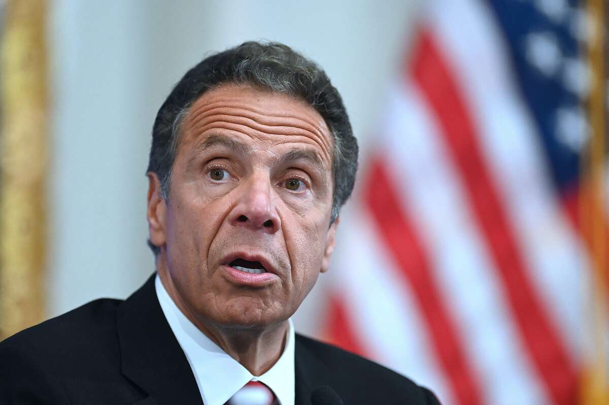 (FILES) In this file photo Governor of New York Andrew Cuomo speaks during a press conference at the New York Stock Exchange (NYSE) on May 26, 2020 at Wall Street in New York City. - Prominent Democratic politicians called on February 28, 2021 for an independent investigation into sexual harassment allegations against New York governor Andrew Cuomo after a second former aide accused him of misconduct. The latest allegations were made public on Saturday after 25-year-old former health advisor Charlotte Bennett told The New York Times the governor sexually harassed her in 2020. (Photo by Johannes EISELE / AFP) (Photo by JOHANNES EISELE/AFP via Getty Images)