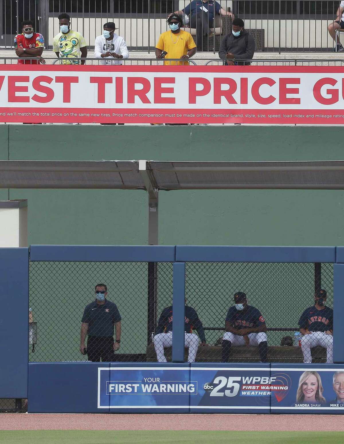 Houston Astros pitcher Framber Valdez (59) and other Astros pitchers stand in street clothes above the Astros bullpen during the first inning of an MLB spring training game at Ballpark of the Palm Beaches in West Palm Beach, Florida, Sunday, February 28, 2021.