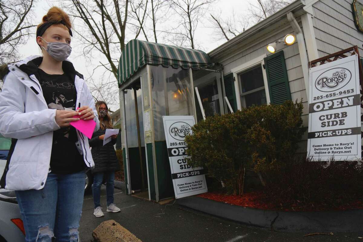 Dallas Rockne of Darien waits to pick up some desserts at Rory's.