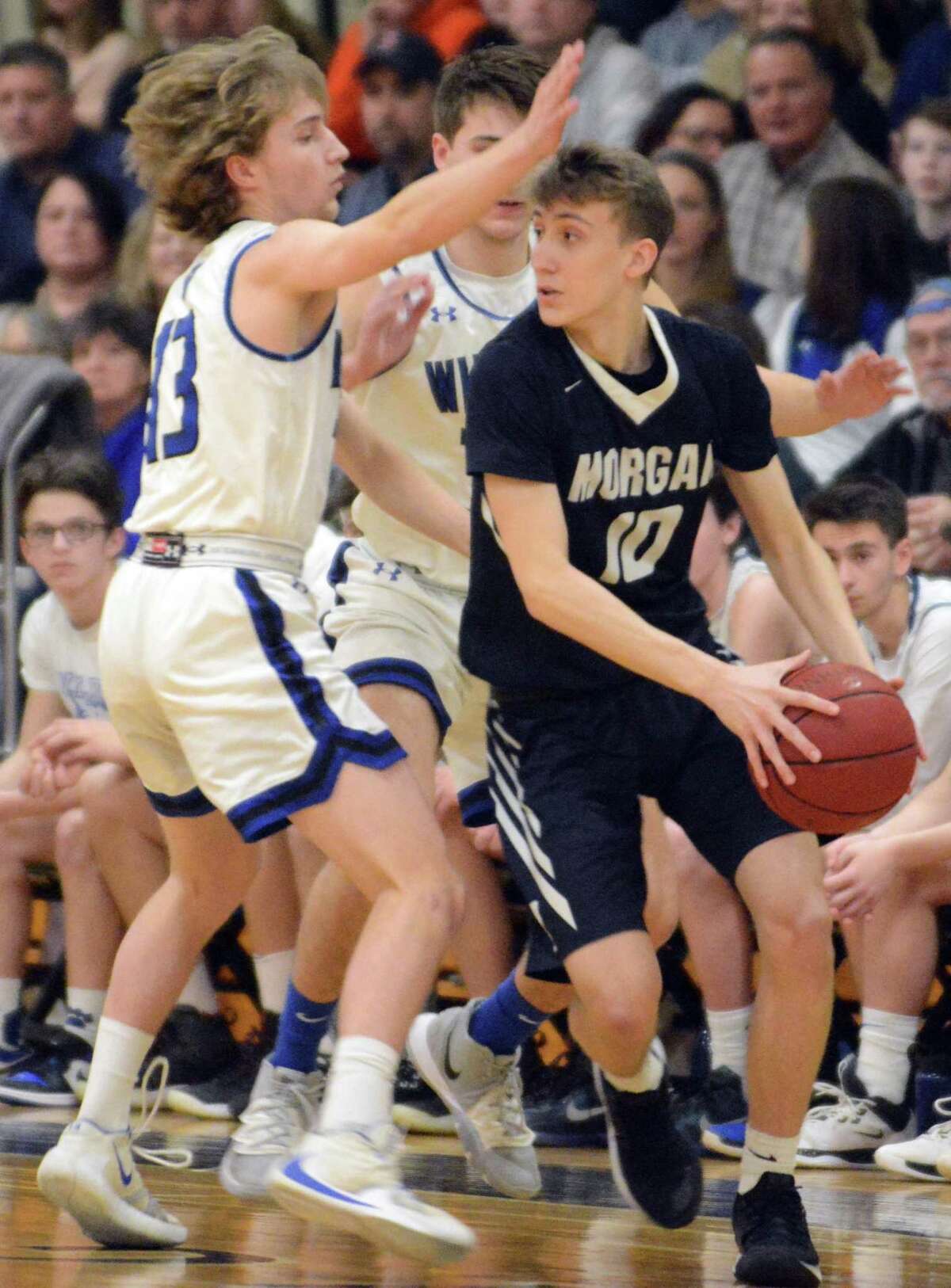 Morgan's Zach Johnson is defended by Old Lyme's Brady Sheffield.