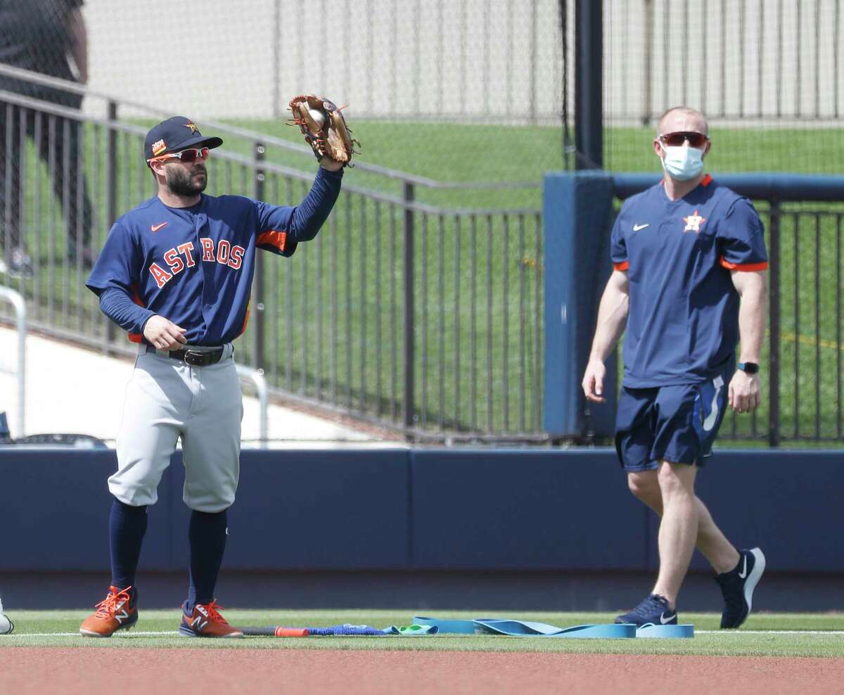 Houston Astros second baseman Jose Altuve (27) warms up before the start of the first inning of an MLB spring training game at Ballpark of the Palm Beaches in West Palm Beach, Florida, Monday, March 1, 2021.