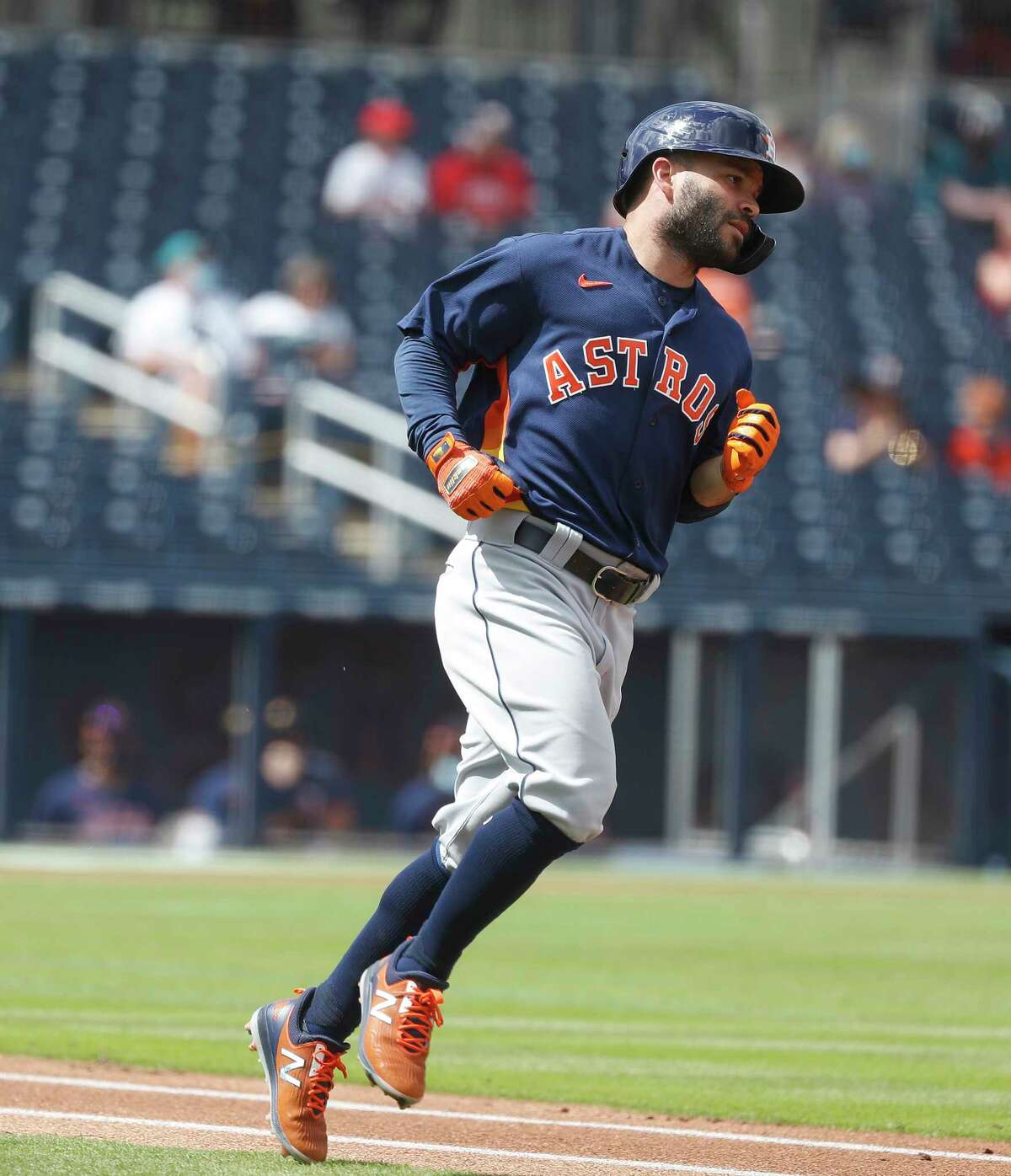Houston Astros Jose Altuve (27) runs to first base as he lined out during the first inning of an MLB spring training game at Ballpark of the Palm Beaches in West Palm Beach, Florida, Monday, March 1, 2021.