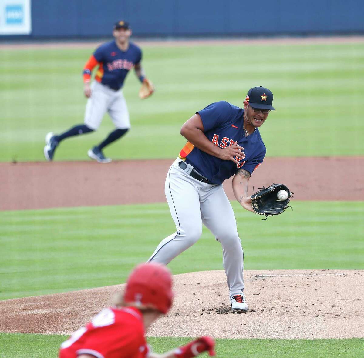 Houston Astros starting pitcher Nivaldo Rodriguez (68) catches Washington Nationals Andrew Stevenson's ground ball during the first inning of an MLB spring training game at Ballpark of the Palm Beaches in West Palm Beach, Florida, Monday, March 1, 2021.