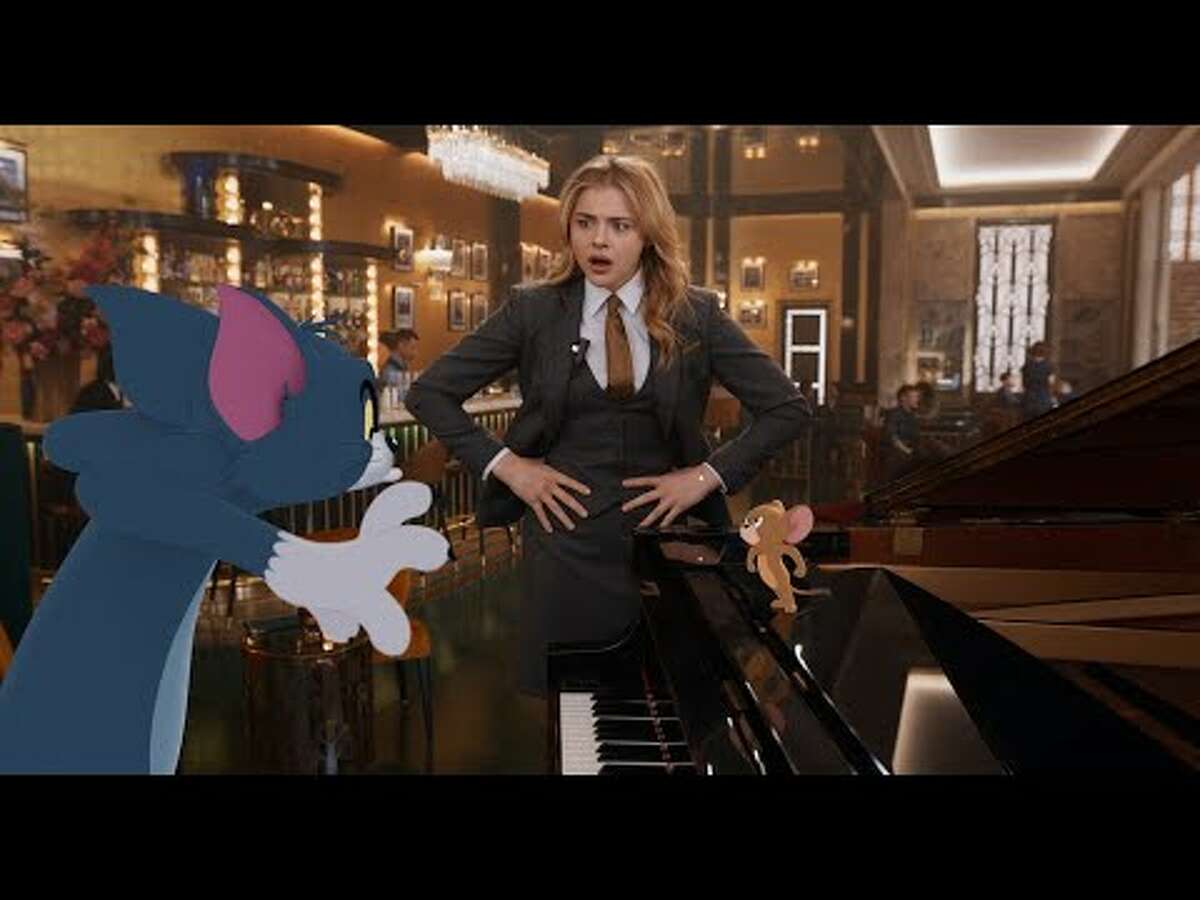 Chloë Grace Moretz, er, her hotel employee character, collects a paycheck in 'Tom & Jerry.'