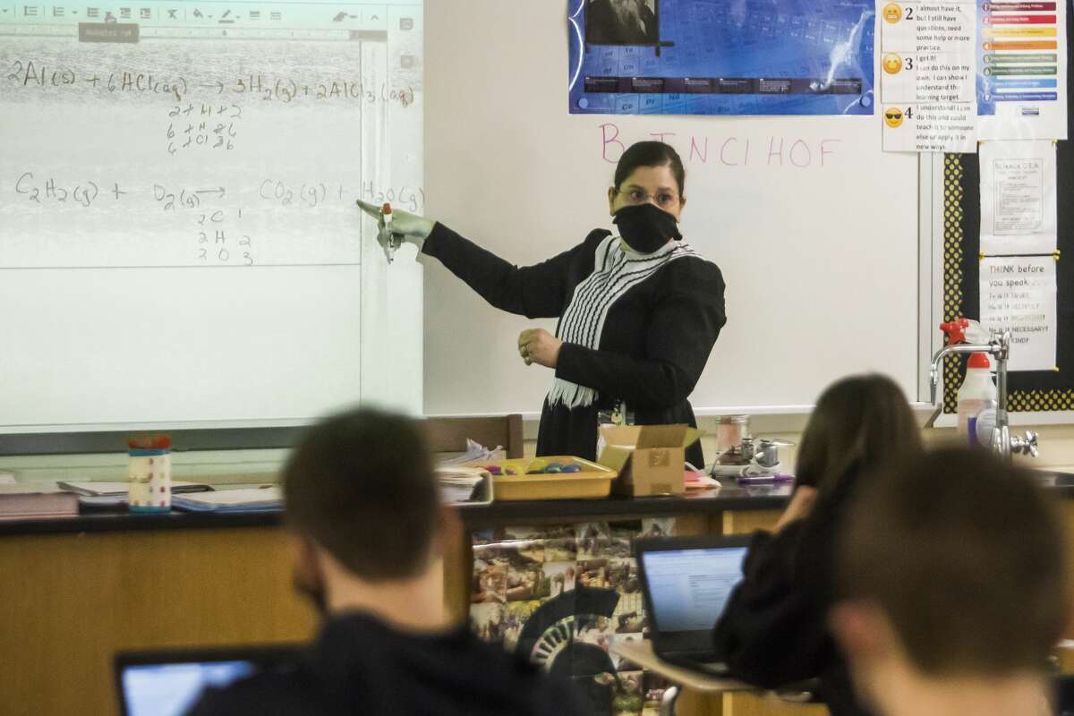 Patty Sawicki, a chemistry teacher at Bullock Creek High School, teaches class dressed as Marie Curie Monday, March 1, 2021 as staff and students celebrate Women's History Month with a scavenger hunt. Notable figures represented include Ruth Bader Ginsburg, Frida Kahlo, Eleanor Roosevelt and fifteen others. (Katy Kildee/kkildee@mdn.net)