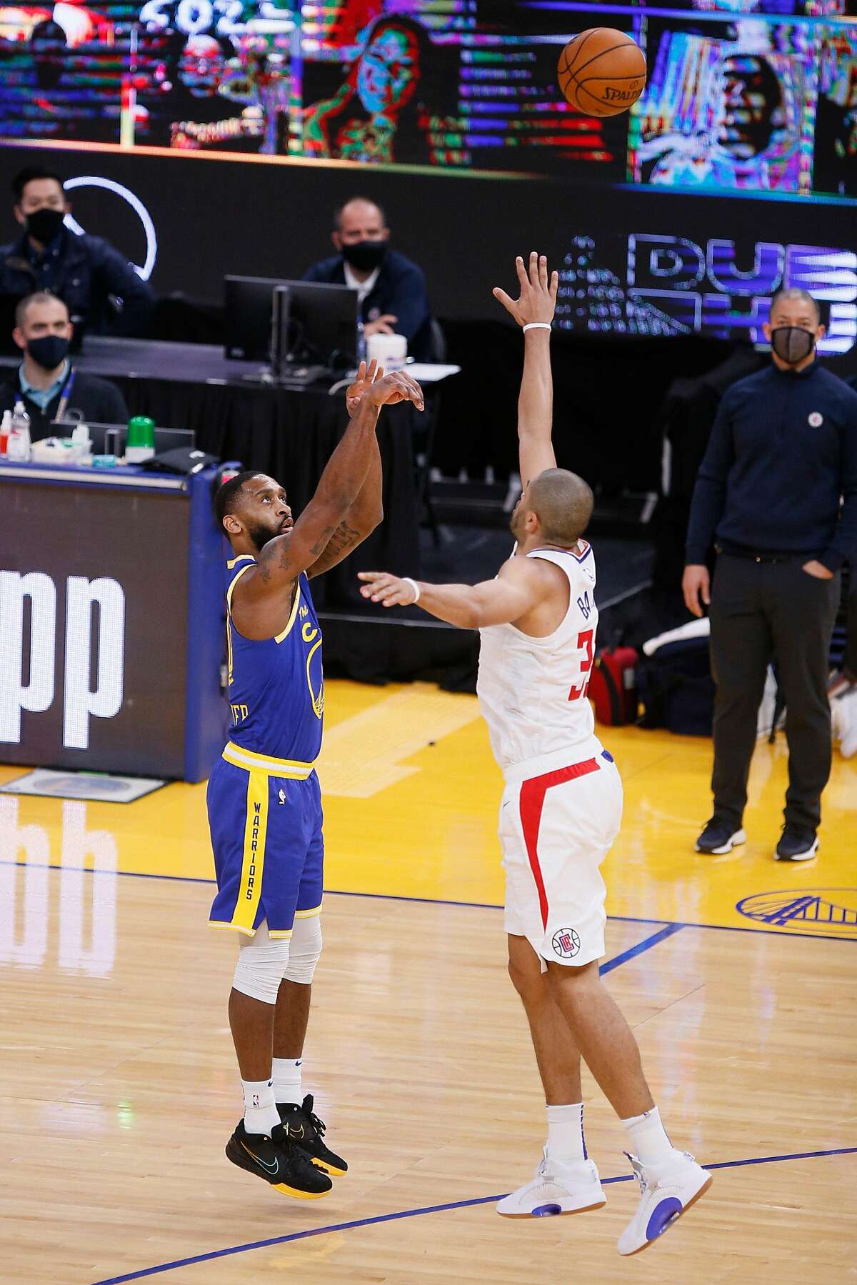 Golden State Warriors guard Brad Wanamaker (10) scores a three-point field goal against LA Clippers forward Nicolas Batum (33) in the fourth quarter during an NBA game at Chase Center, Friday, Jan. 8, 2021, in San Francisco, Calif. The Warriors won 115-105.