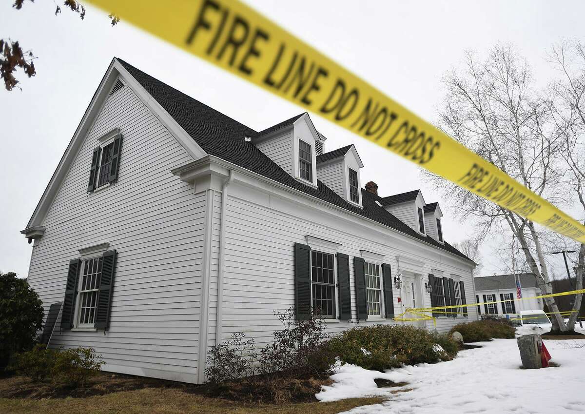 Fire line tape surrounds the Roxbury Ambulance building, site of an arson investigation at 27 North Street in Roxbury, on Sunday. Suspect Richard White, of Torrington, is currently in the custody of the Pennsylvania State Police.